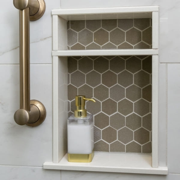 Brushed Gold Grab Bar and Built-In Toiletry Shelf Inside Walk-In Shower | Louisville Handyman and Remodeling